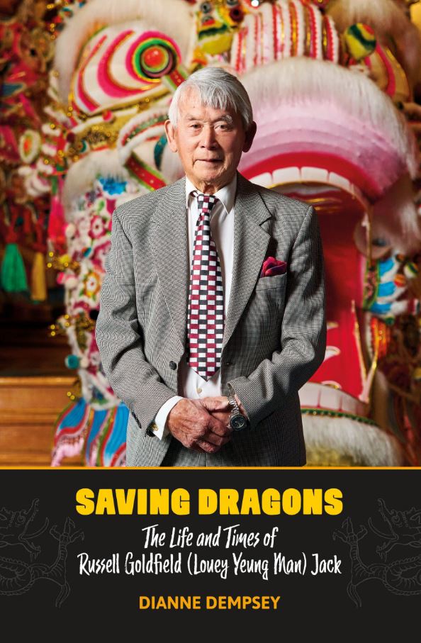 Book cover for "Saving Dragons" by Dianne Dempsey featuring a portrait of Russell Jack standing in front of a Chinese dragon.